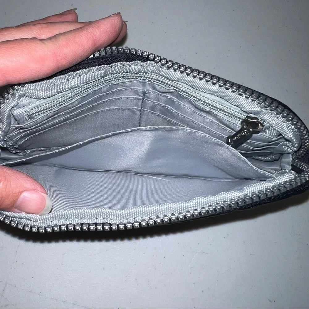 Par Kour black wristlet wallet. RFID technology, zipper with strap